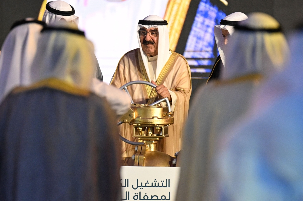 Kuwait Amir HH Sheikh Mishal Al-Ahmad Al-Jaber Al-Sabah (C) turns a symbolic equipment during the opening of the Al-Zour oil Refinery on May 29, 2024, in al-Zour, south of Kuwait City. (Photo by Yasser Al-Zayyat / AFP)