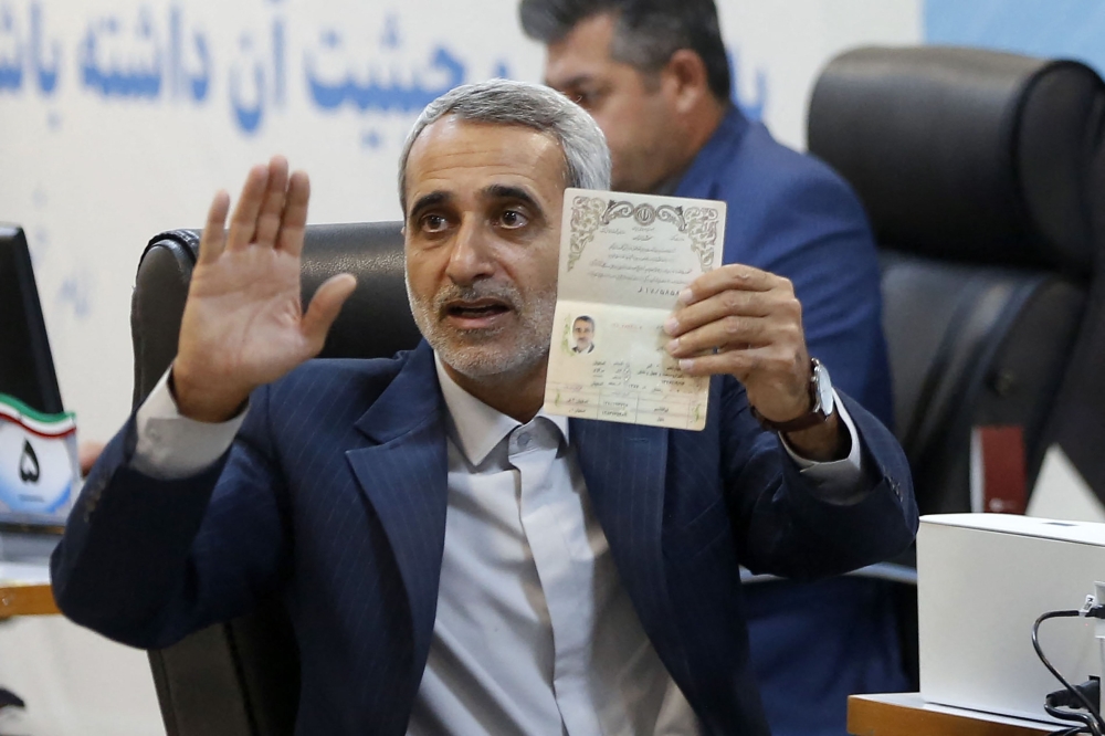 Iranian parliament lawmaker Abbas Moghtadaei registers at the elections registration office in Tehran on May 30, 2024, on the first day of signing up ahead of the country's election of a new president next month. Photo by AFP.