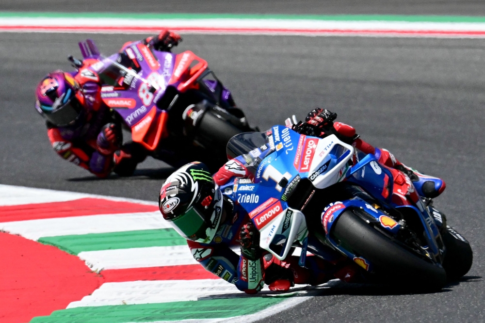 Ducati Italian rider Francesco Bagnaia and Ducati Spanish rider Jorge Martin ride during the the Italian MotoGP race at Mugello on June 2, 2024. (Photo by Marco BERTORELLO / AFP)