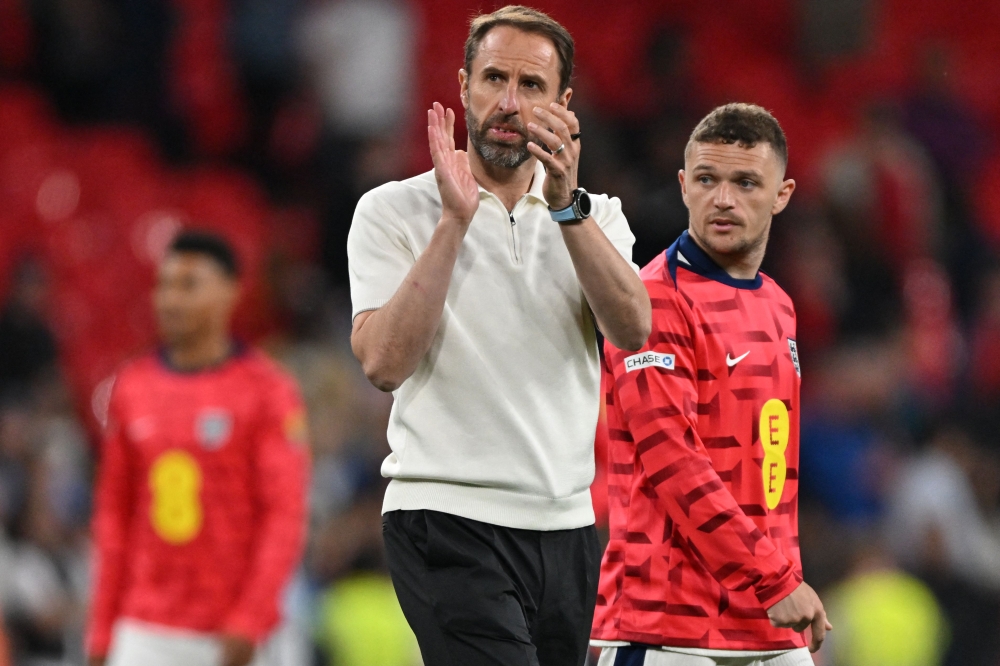 England's manager Gareth Southgate applauds fans on the pitch after the International friendly football match between England and Iceland at Wembley Stadium in London on June 7, 2024.  (Photo by Glyn Kirk / AFP)