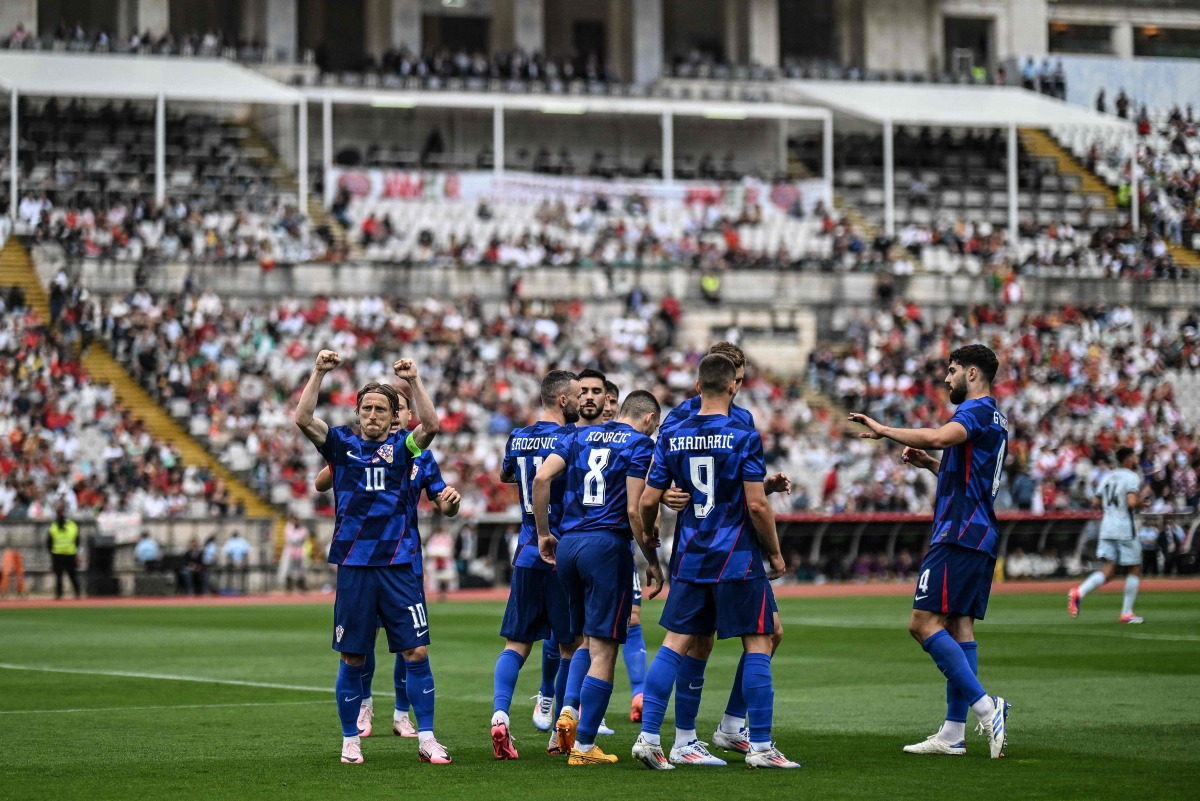 Croatia midfielder Luka Modric celebrates after scoring his team's first goal during the international friendly football match between Portugal and Croatia at Jamor stadium in Oeiras on June 8, 2024. (Photo by PATRICIA DE MELO MOREIRA / AFP)
