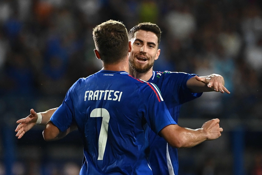 Italy's midfielder Davide Frattesi celebrates with teammate Italy's midfielder Jorginho after scoring his team first goal during the International friendly football match between Italy and Bosnia-Herzegovina in Empoli on June 09, 2024. (Photo by Isabella Bonotto / AFP)

