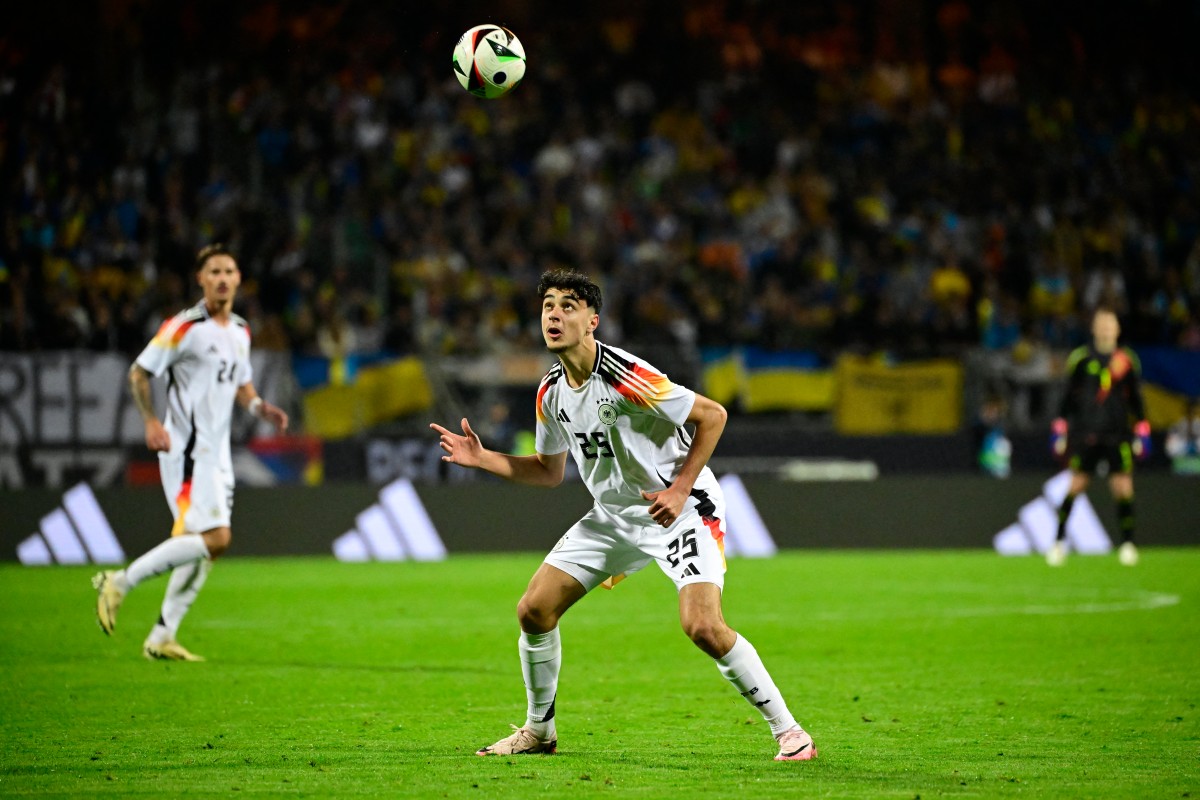 Germany's midfielder #25 Aleksandar Pavlovic eyes the ball during the friendly football match Germany v Ukraine, in Nuremberg, eastern Germany, on June 3, 2024. Photo by Tobias SCHWARZ / AFP.