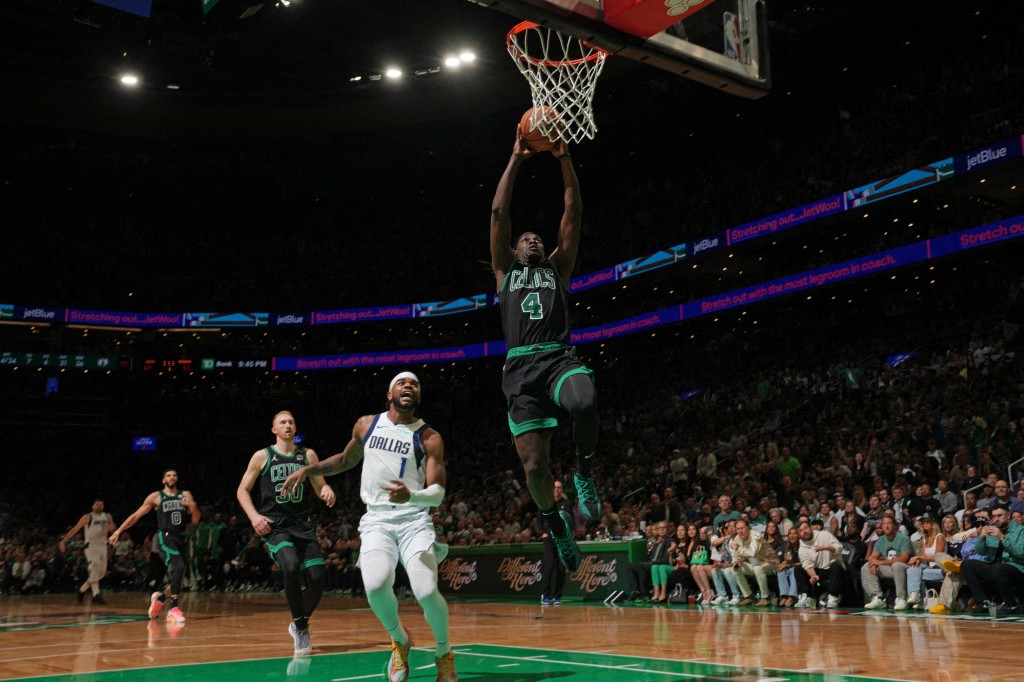 Boston: Jrue Holiday of the Boston Celtics drives to the basket during the game against the Dallas Mavericks during Game 2 of the 2024 NBA Finals on June 9, 2024 at the TD Garden in Boston, Massachusetts.(Photo by Jesse D. Garrabrant /  AFP)