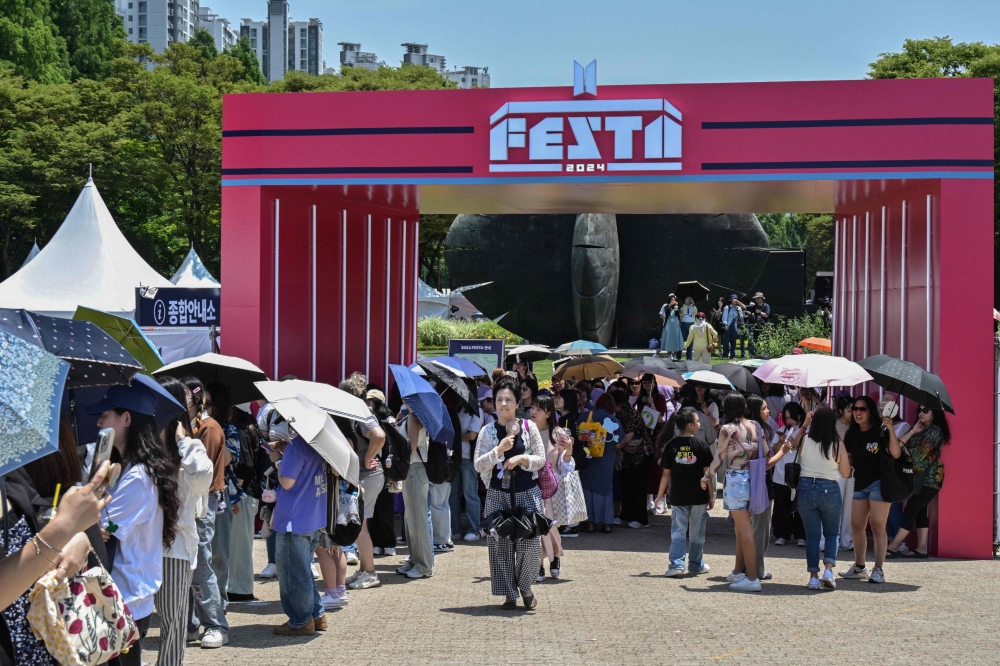 Fans of K-pop boy band BTS attend the annual 'BTS Festa' in Seoul on June 13, 2024. (Photo by Anthony Wallace / AFP)