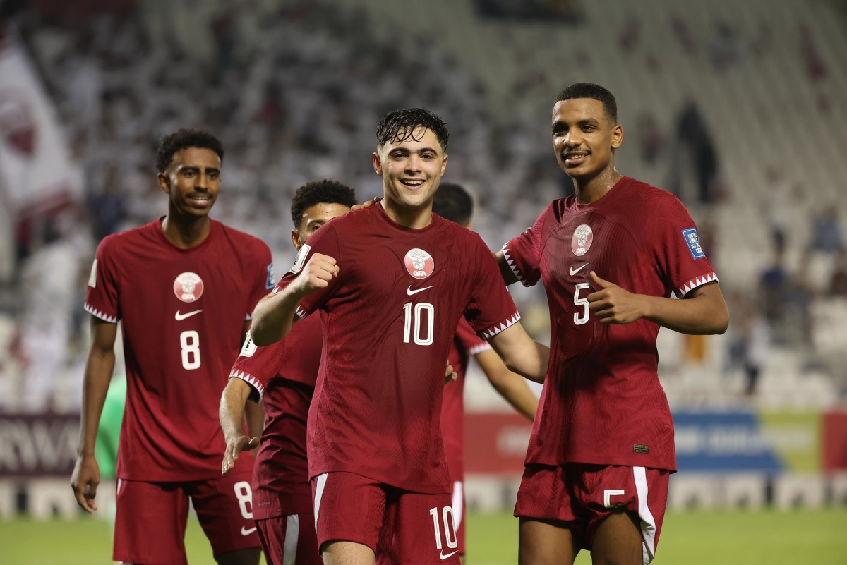 Qatar's Ahmed Al Rawi (centre) celebrates with teammates after scoring a goal during the match against India on Tuesday.