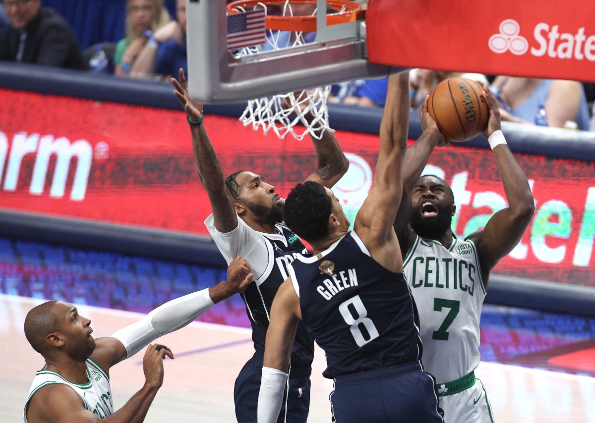 Jaylen Brown of the Boston Celtics shoots the ball against Josh Green of the Dallas Mavericks during the second quarter in Game Four of the 2024 NBA Finals at American Airlines Center on June 14, 2024 in Dallas, (Photo by Tim Heitman / GETTY IMAGES NORTH AMERICA / Getty Images via AFP)
