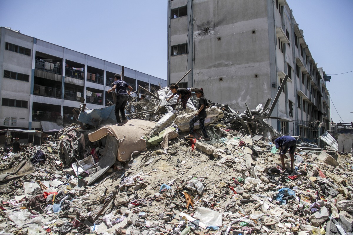 AZA, June 14, 2024 (Xinhua) -- People collect items from the rubble ahead of Eid al-Adha at the Jabalia refugee camp in the northern Gaza Strip, on June 14, 2024. (Photo by Mahmoud Zaki/Xinhua)