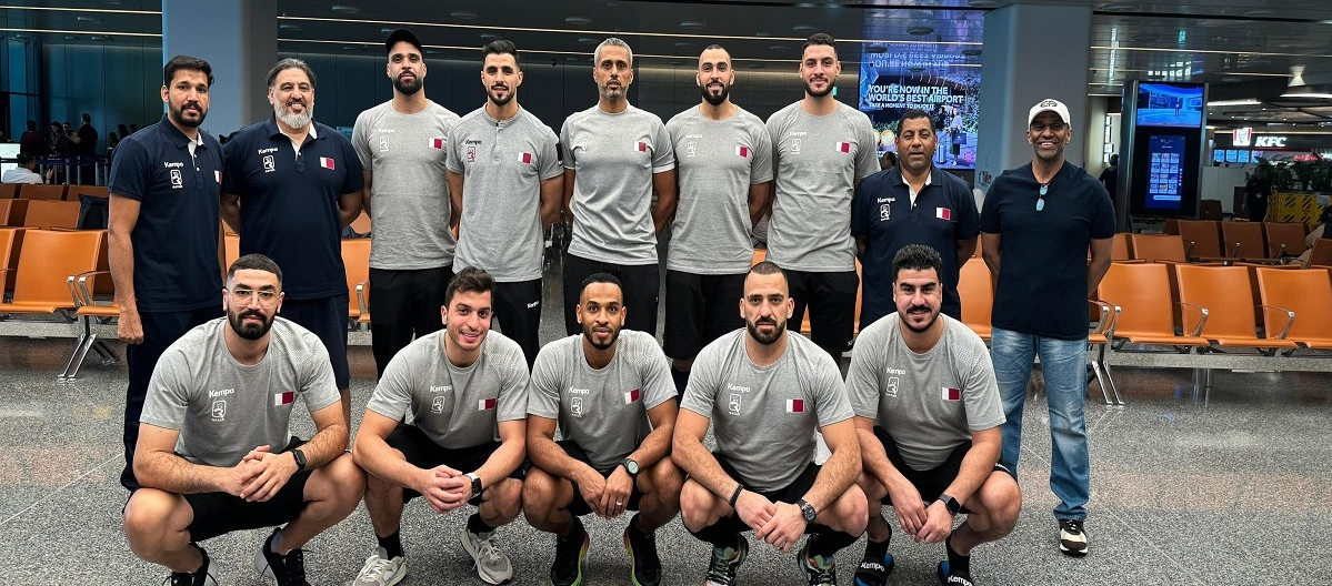 Qatar players and officials pose for a photograph prior to their departure for China.