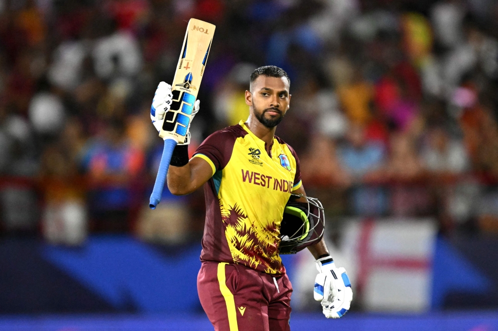 West Indies' Nicholas Pooran reacts after being run out during the ICC men's Twenty20 World Cup 2024 in Gros Islet, St. Lucia, June 17, 2024. (Photo by Timothy A. Clary / AFP)
 