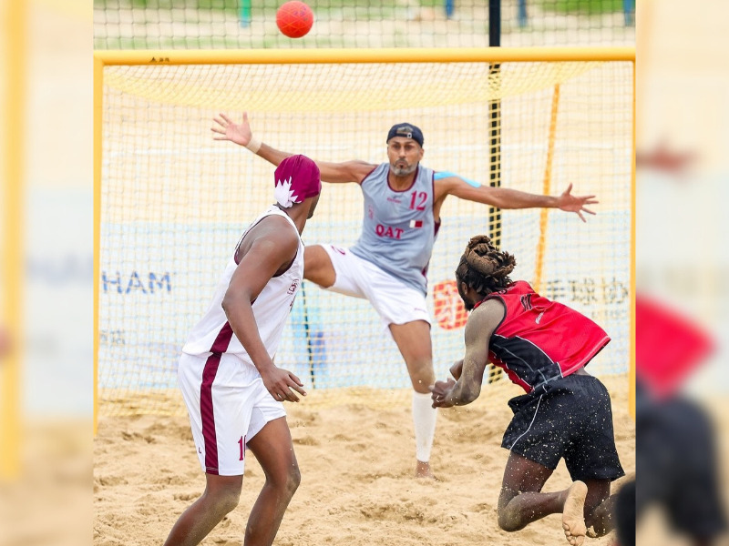 Qatar's goalkeeper Mohsen Mohammed Alyafeai attempts to stop a shot. 