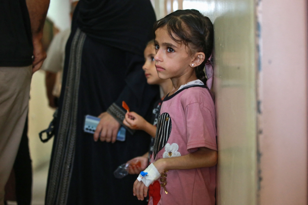 Palestinian children suffering of malnutrition or chronic diseases such as cancer, wait with family members at Nasser hospital in Khan Yunis in the southern Gaza Strip on June 24, 2024. (Photo by Bashar Taleb / AFP)