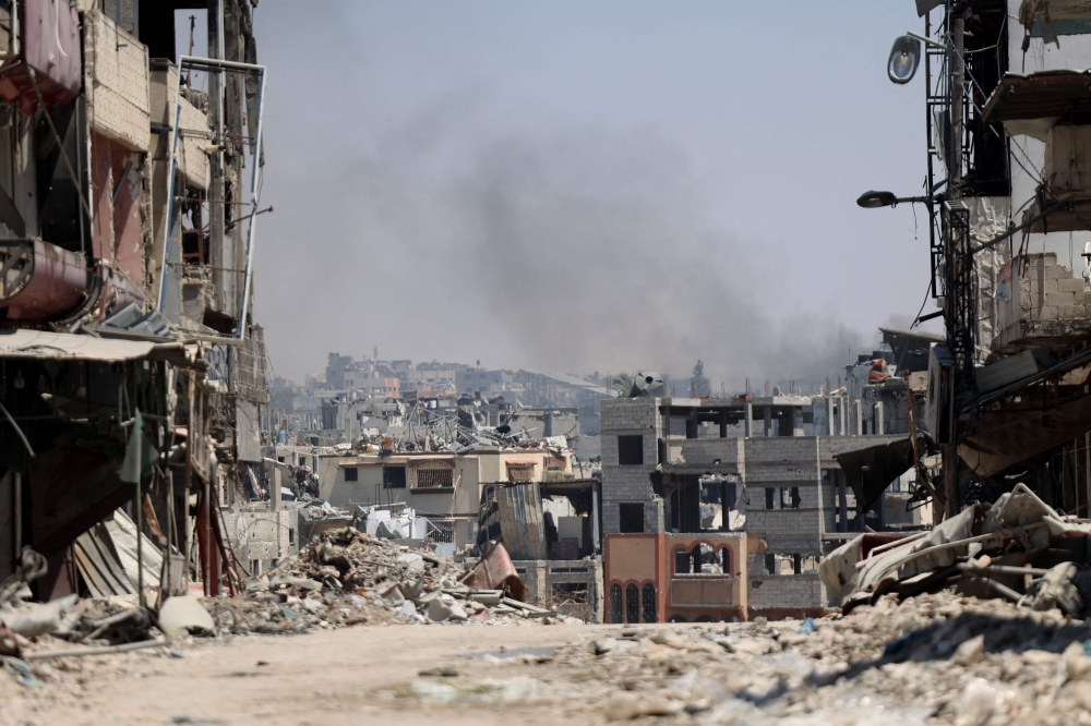 Smoke billows from an area targeted by Israeli bombardment in the Gaza City district of Shujaiya on June 28, 2024. (Photo by Omar Al-Qattaa / AFP)