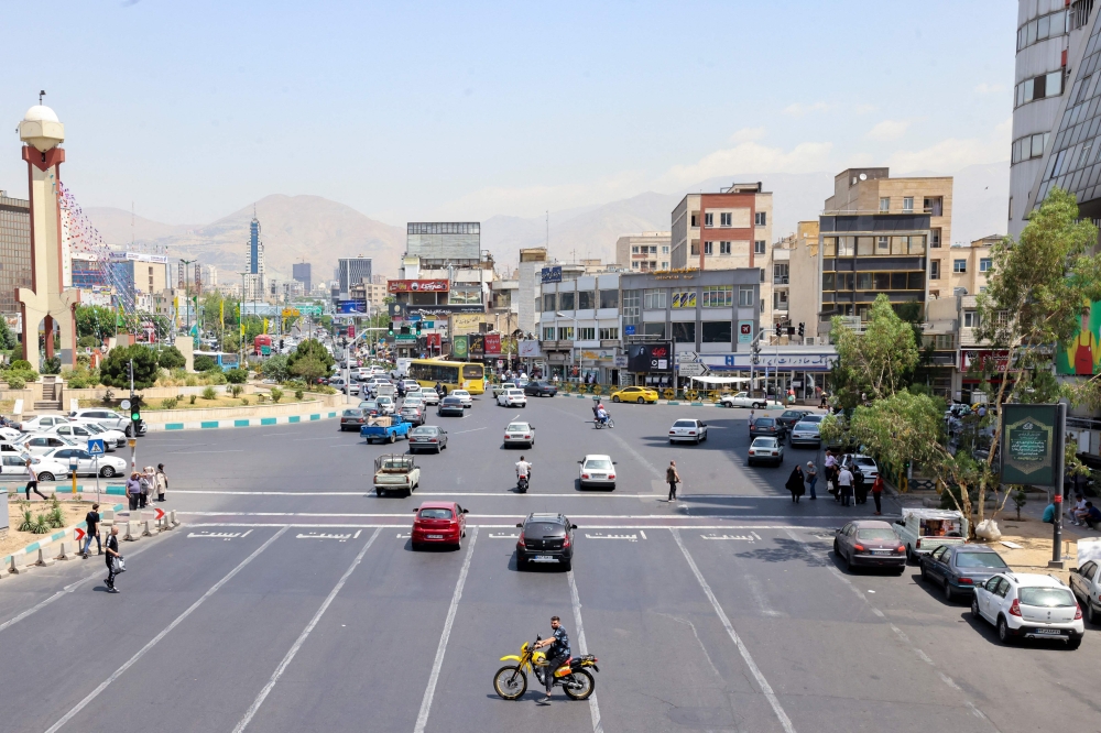 This picture shows a view of the Iranian capital Tehran on June 29, 2024. (Photo by Atta Kenare / AFP)