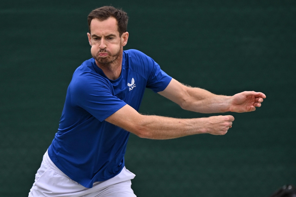 Britain's Andy Murray warms up during a training session ahead of the 2024 Wimbledon Championships at The All England Lawn Tennis and Croquet Club in Wimbledon, southwest London, on June 30, 2024. (Photo by Glyn KIRK / AFP)
