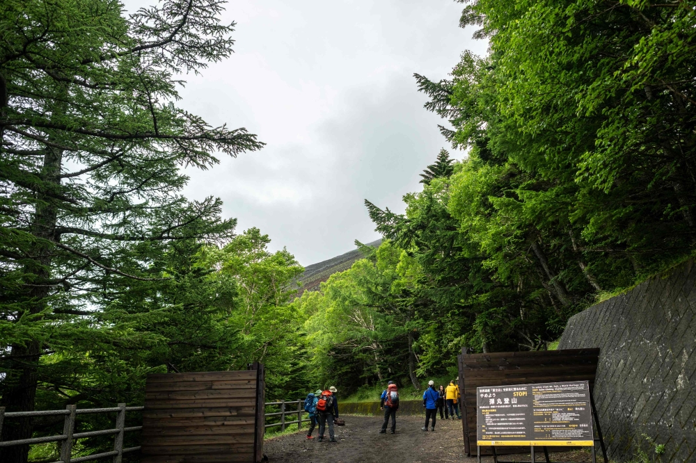 A general view shows the newly-built trail gate at Fuji Subaru Line 5th station, which leads to the popular Yoshida trail to climb Mount Fuji on July 1, 2024. (Photo by Philip Fong / AFP)