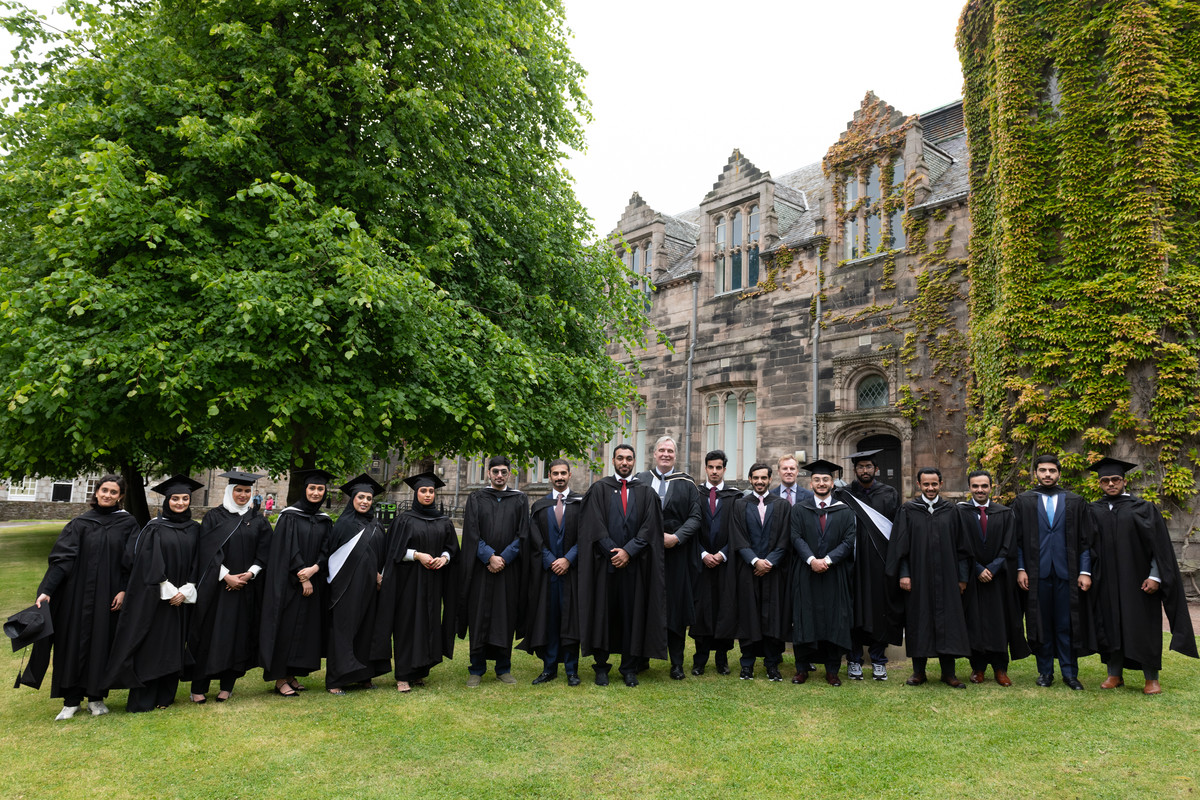 Graduates from Qatar campus along with officials in Scotland.