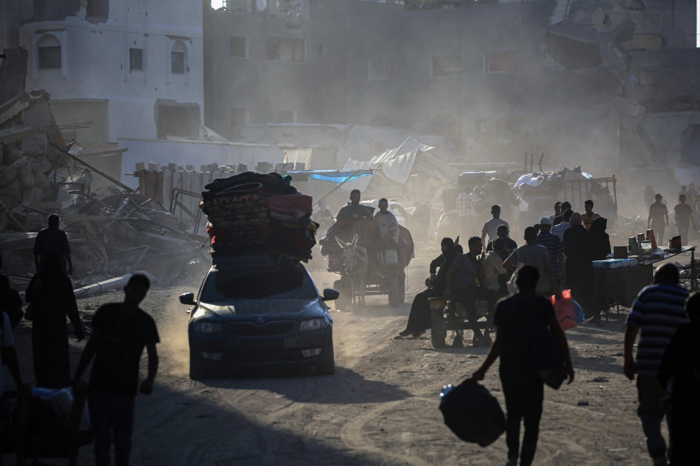 Displaced Palestinians from areas in east Khan Yunis arrive to the city as they flee after the Israeli army issued a new evacuation order for parts of the city and Rafah, in the southern Gaza Strip on July 2, 2024. (Photo by Eyad Baba / AFP)