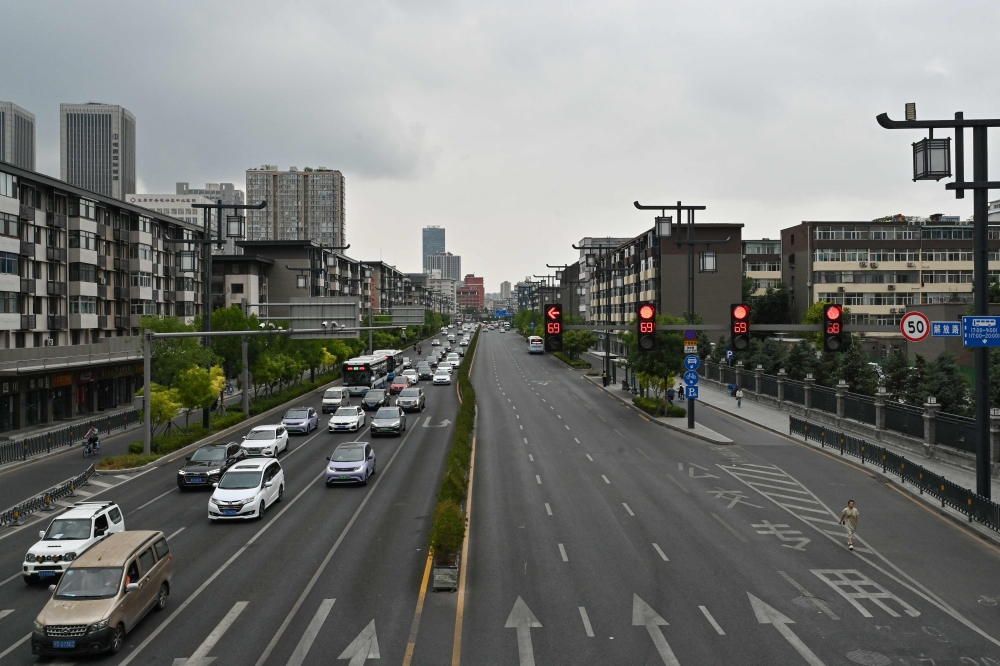 This picture shows a general view of traffic in Taiyuan, in China's northern Shanxi province on July 2, 2024. (Photo by Adek Berry / AFP)