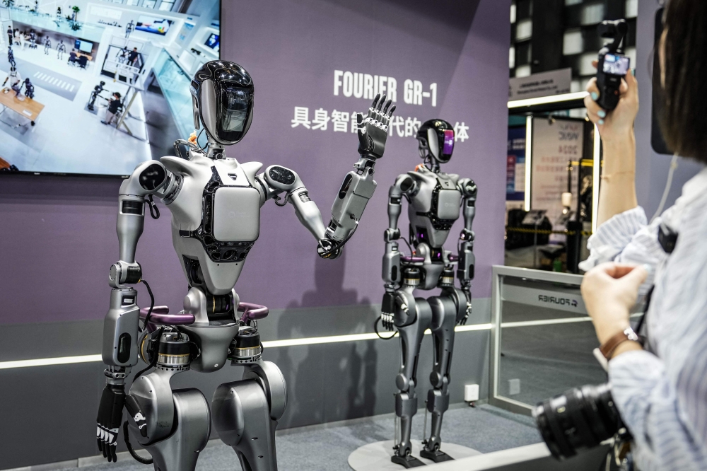 Fourier's GR-1 humanoid robots are displayed during the World Artificial Intelligence Conference (WAIC) in Shanghai on July 4, 2024. (Photo by AFP) 
