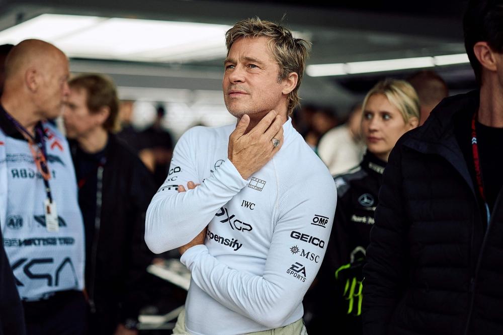 Hollywood actor Brad Pitt, acting in an upcoming Formula One-based movie, follows the second practice session at the Silverstone motor racing circuit on July 5, 2024. (Photo by Benjamin Cremel / AFP)