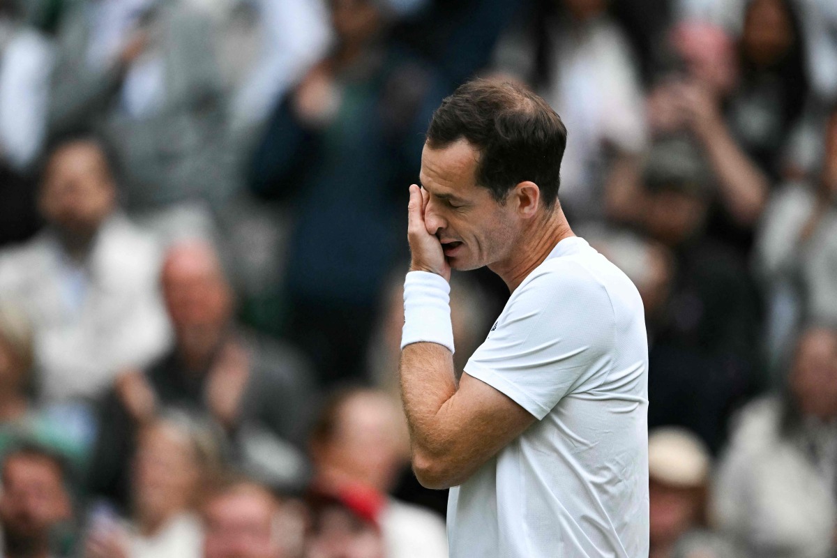 Britain's Andy Murray cries as he delivers a speech at the end of his men's doubles tennis match with his brother Britain's Jamie Murray, during a farewell ceremony to celebrate his last Wimbledon, on the fourth day of the 2024 Wimbledon Championships at The All England Lawn Tennis and Croquet Club in Wimbledon, southwest London, on July 4, 2024. (Photo by Ben Stansall / AFP) 
