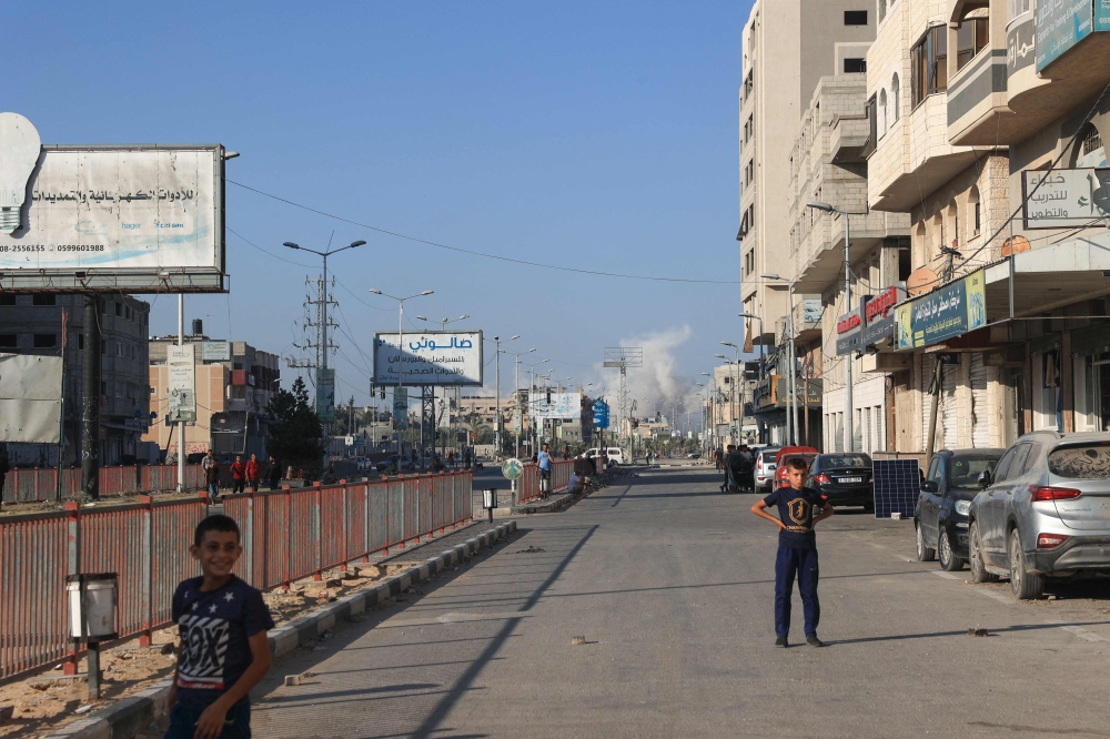 A picture taken from al-Bureij refugee camp in the central Gaza Strip shows smoke billowing after Israeli bombardment in the Wadi Gaza (Gaza Valley) area on July 8, 2024. (Photo by Eyad BABA / AFP)
