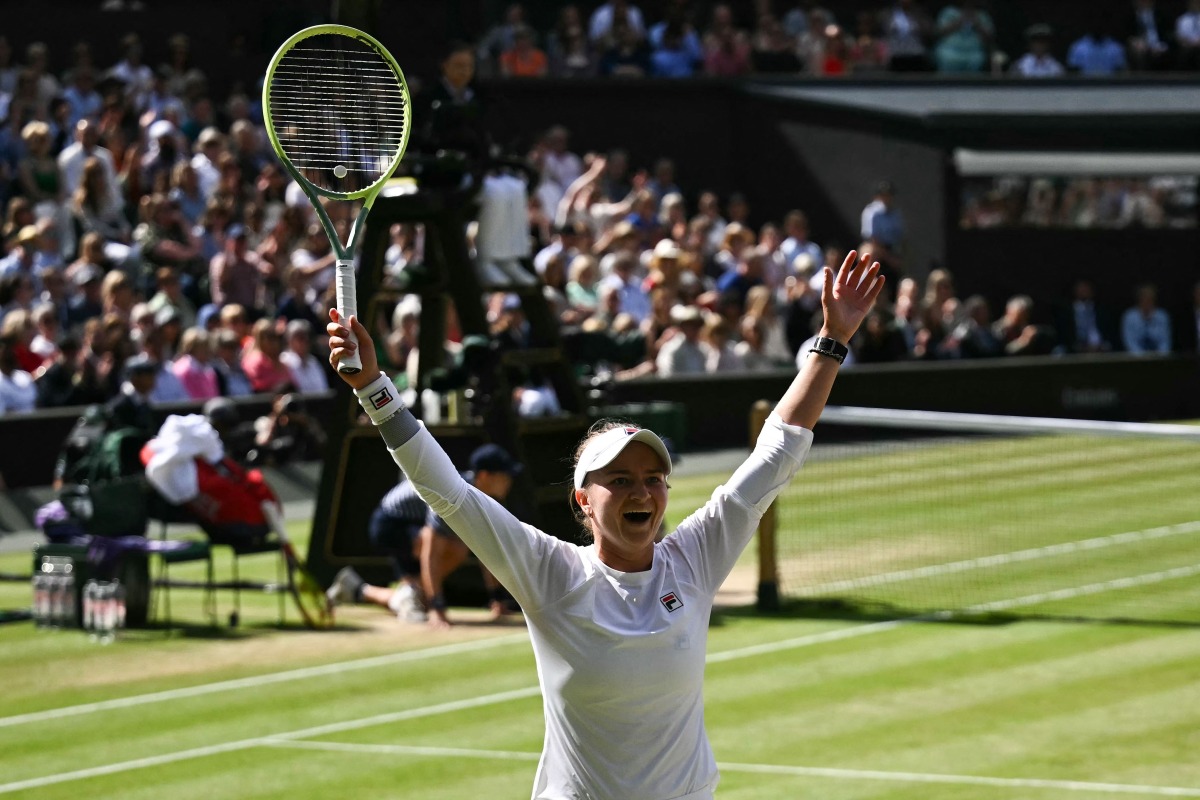 Czech Republic's Barbora Krejcikova celebrates winning against Italy's Jasmine Paolini during their women's singles final tennis match on the thirteenth day of the 2024 Wimbledon Championships at The All England Lawn Tennis and Croquet Club in Wimbledon, southwest London, on July 13, 2024. (Photo by Ben Stansall / AFP) 
