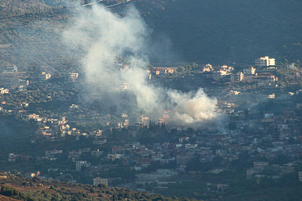 Smoke bilows following an Israeli strike in the village of Kfar Kila in southern Lebanon on July 16, 2024, amid continuing tensions on the Lebanese-Israeli border. (Photo by Rabih DAHER / AFP)
