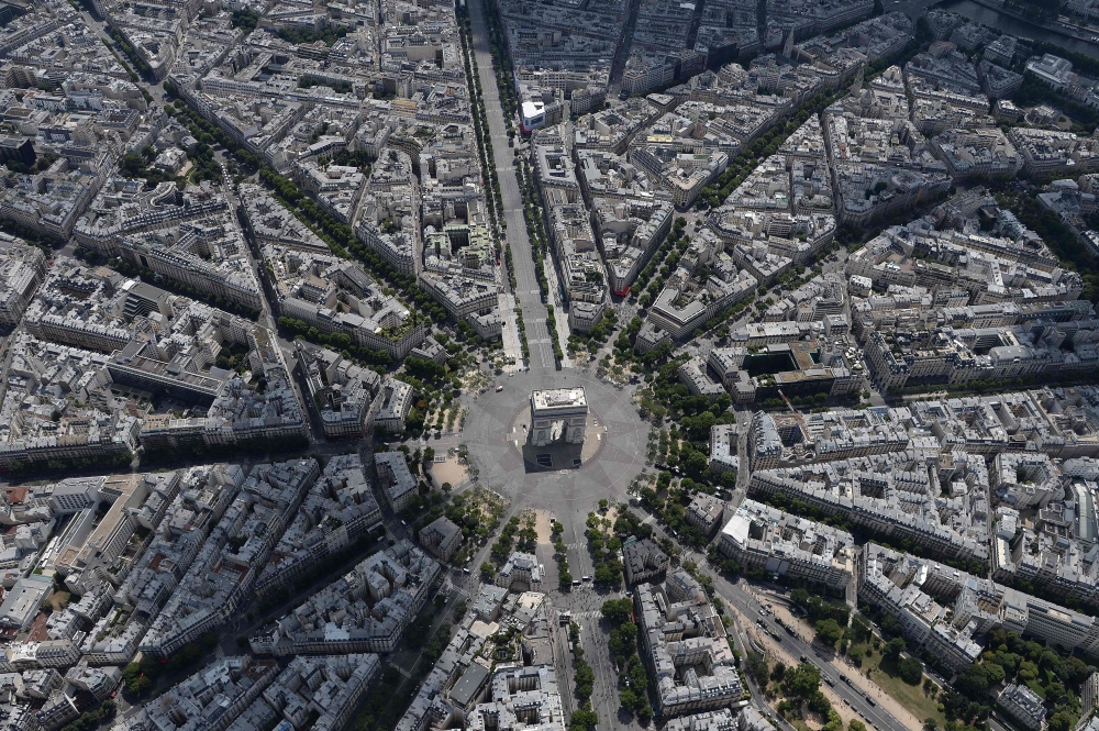 An aerial view shows the Arc de Triomphe during the annual Bastille Day military parade on the Champs-Elysees avenue in Paris on July 14, 2017.  Photo by JEAN-SEBASTIEN EVRARD / AFP