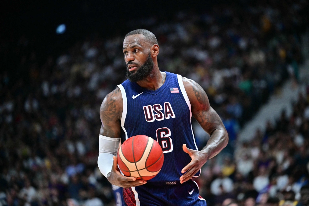 USA's forward #06 LeBron James looks on during the Basketball Showcase friendly match between the United States and Australia at Etihad Arena in Abu Dhabi on July 15, 2024. Photo by Giuseppe CACACE / AFP