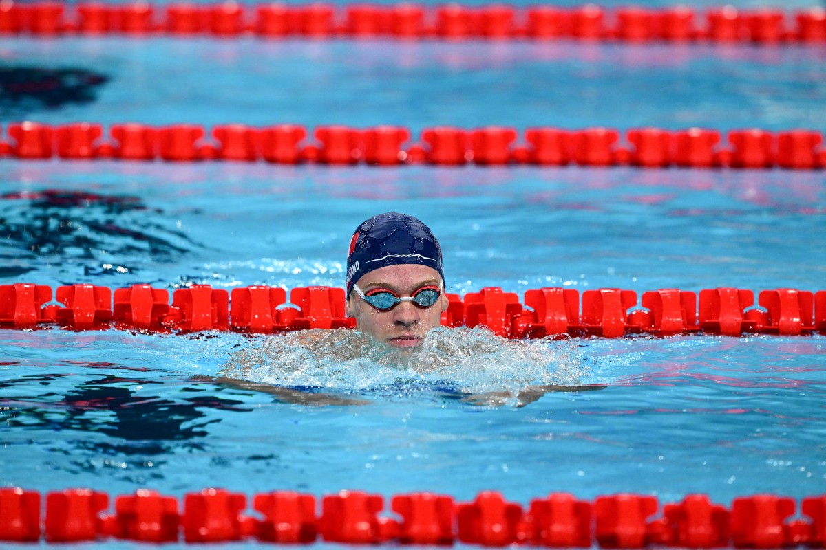 France's Leon Marchand reacts after a heat of the men's 200m individual medley swimming event during the Paris 2024 Olympic Games at the Paris La Defense Arena in Nanterre, west of Paris, on August 1, 2024. Photo by François-Xavier MARIT / AFP.