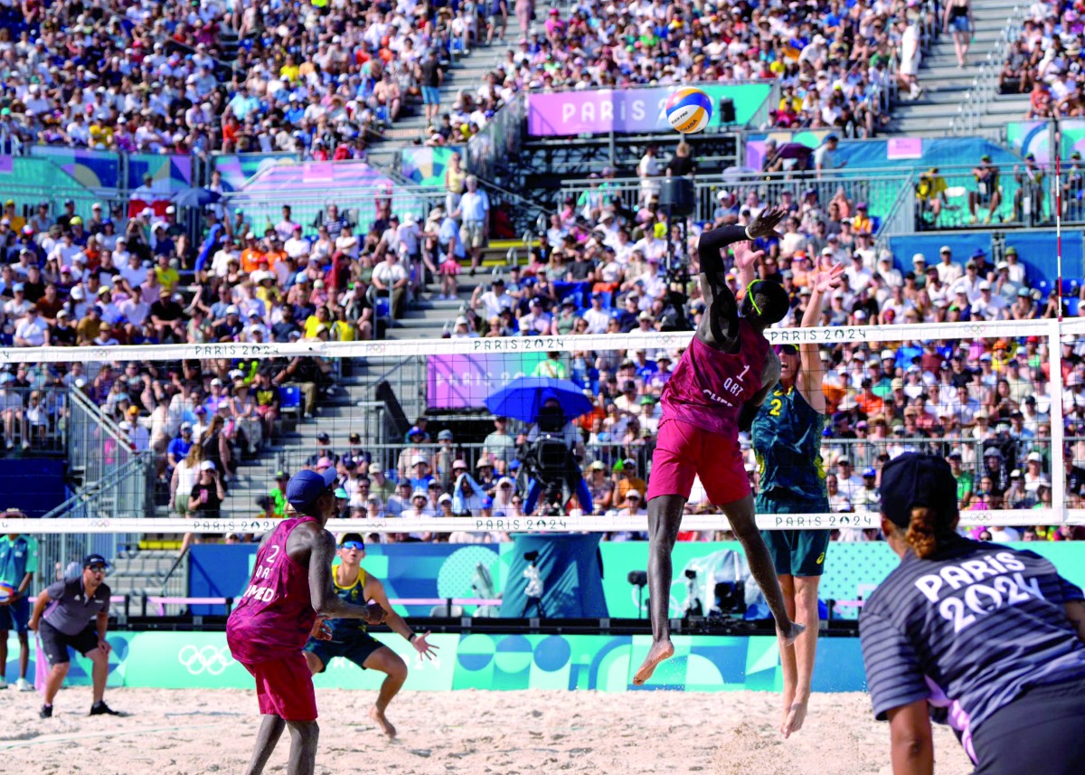 Qatar’s Cherif Younousse shoots to score a point. 