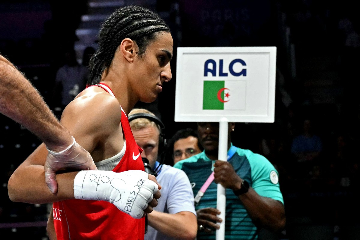 Algeria's Imane Khelif leaves after her women's 66kg preliminaries round of 16 boxing match against Italy's Angela Carini during the Paris 2024 Olympic Games at the North Paris Arena, in Villepinte on August 1, 2024. (Photo by MOHD RASFAN / AFP)
