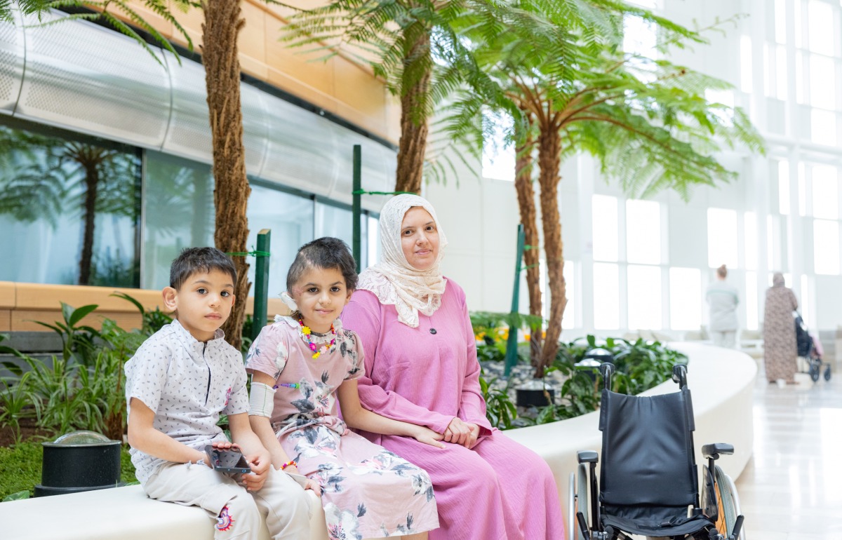 Nine-year-old Mayar (centre) underwent a brain surgery at Sidra Medicine after sustaining a head injury from a blast. Here she is seen with her mother and brother.