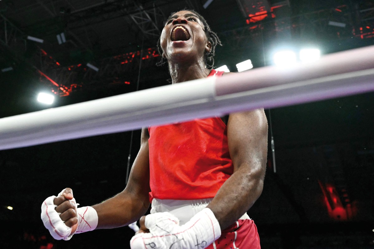 Refugee Olympic Team’s Cindy Ngamba reacts after beating France’s Davina Michel yesterday. 