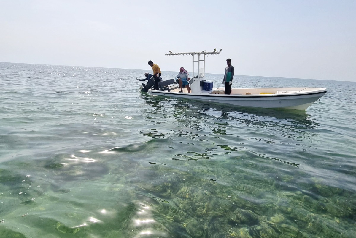 MECC officials seizing the fishing net.