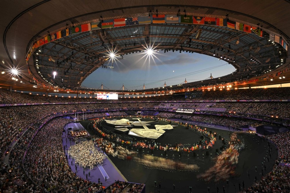 Athletes take part in a parade during the closing ceremony of the Paris 2024 Olympic Games at the Stade de France, in Saint-Denis, in the outskirts of Paris, on August 11, 2024. (Photo by Luis Robayo / AFP)