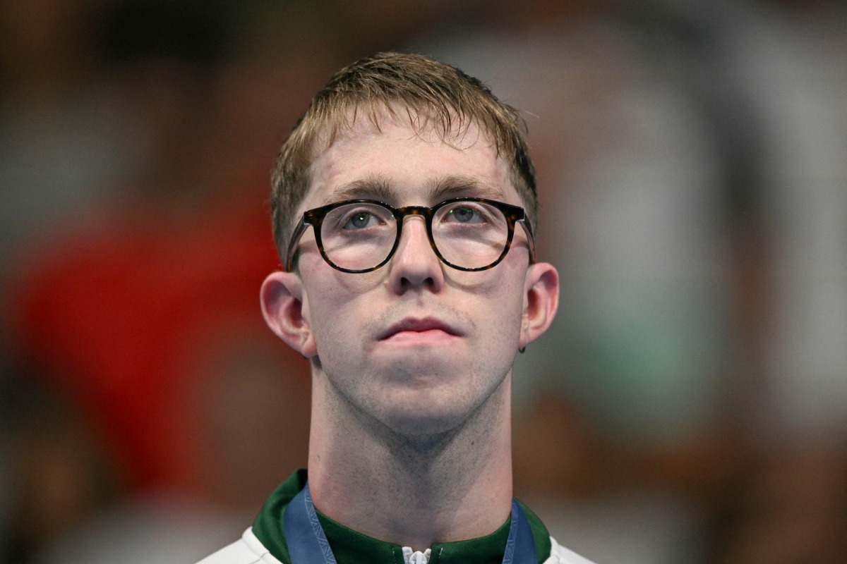 Silver medallist Ireland's Daniel Wiffen poses on the podium of the men's 1500m freestyle swimming event during the Paris 2024 Olympic Games at the Paris La Defense Arena in Nanterre, west of Paris, on August 4, 2024. Photo by Oli SCARFF / AFP.