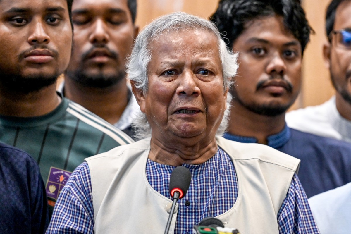 Nobel laureate Muhammad Yunus (C) speaks during a press conference upon his arrival at the Hazrat Shahjalal International Airport in Dhaka on August 8, 2024. 
 (Photo by Munir UZ ZAMAN / AFP)