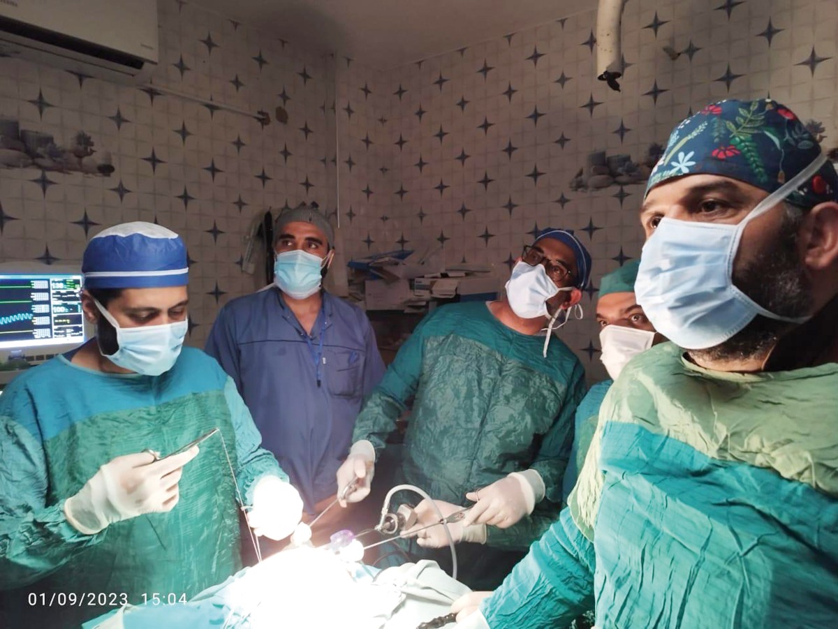 Dr. Mansour Ali (third left) performing a surgery during a medical mission.