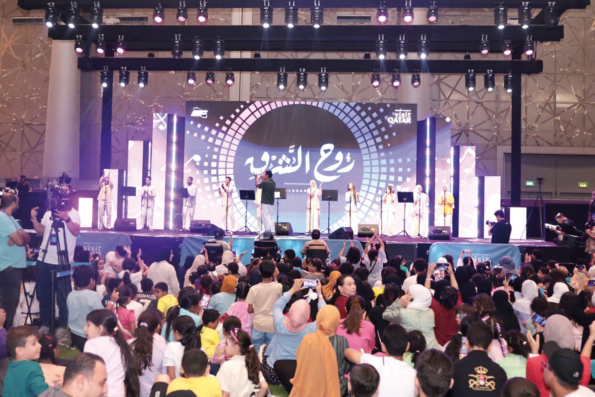 Participants watch a performance during the closing ceremony of the festival yesterday.