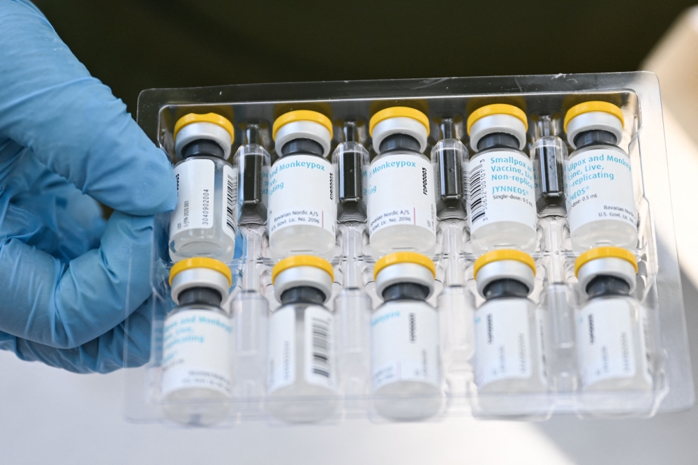 (FILES) This file photo taken on August 9, 2022 shows vials of the JYNNEOS Monkeypox vaccine are prepared at a pop-up vaccination clinic in Los Angeles, California. (Photo by Patrick T. FALLON / AFP)
