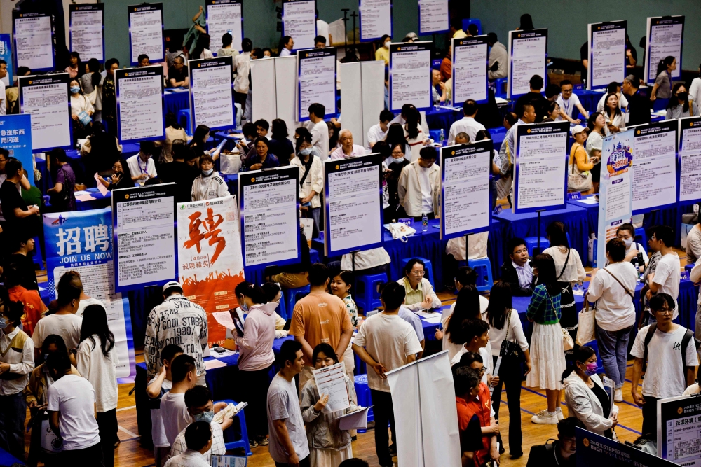 This photo taken on June 2, 2024 shows people attending a job fair in Huai'an, in eastern China's Jiangsu province. Photo by AFP