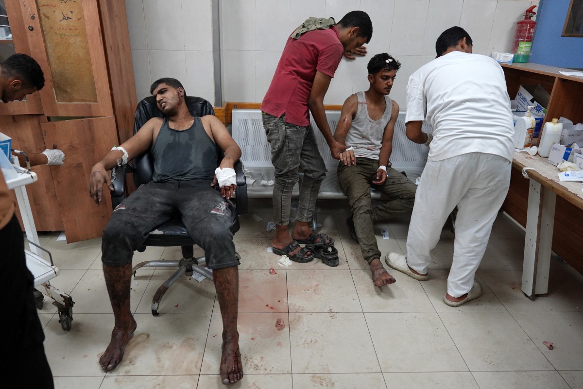 Injured Palestinians receive emergency treatment at the Nasser hospital following Israeli bombardment on Khan Yunis in the southern Gaza Strip on August 14, 2024. Photo by Bashar TALEB / AFP