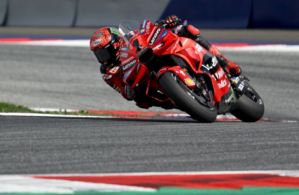 Ducati Lenovo Team's Italian rider Francesco Bagnaia races to win the Tissot Sprint Race of the Austrian MotoGP weekend at the Red Bull Ring racetrack in Spielberg, Austria on August 17, 2024. (Photo by Jure Makovec / AFP)