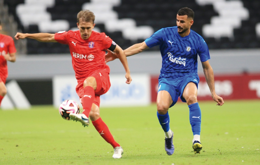 Sekou Yansane (left) scored the winning goal for Al Ahli against Al Gharafa at Al Thumama Stadium yesterday. ABOVE: Action during match between Al Khor and Al Shahania at Al Bayt Stadium yesterday.