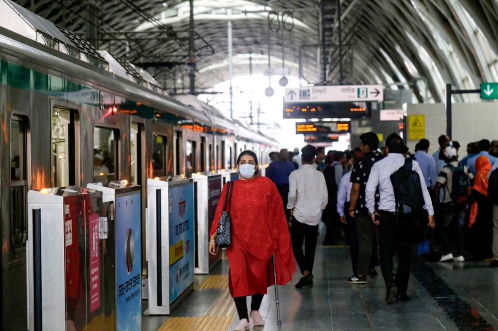 Passengers arrive at a metro train station in Dhaka on August 25, 2024. Photo by Rahman ASAD / AFP