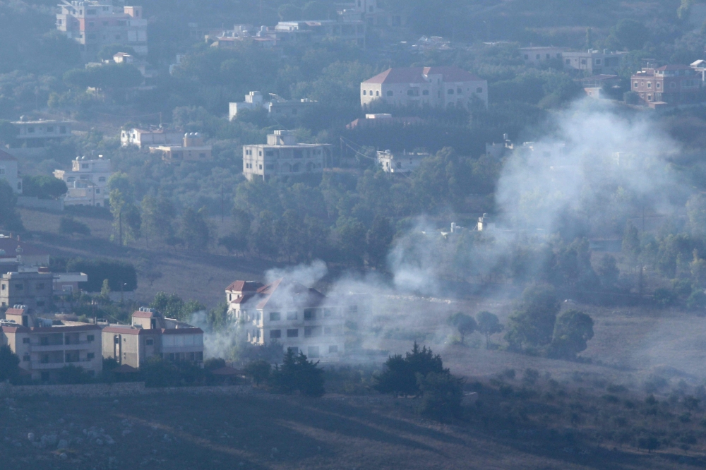 Smoke billows from an area targeted by an Israeli airstrike on the southerm Lebanese village of Khiam on August 25, 2024, amid escalations in the ongoing cross-border tensions as fighting continues in the Gaza Strip. (Photo by Rabih Daher / AFP)
