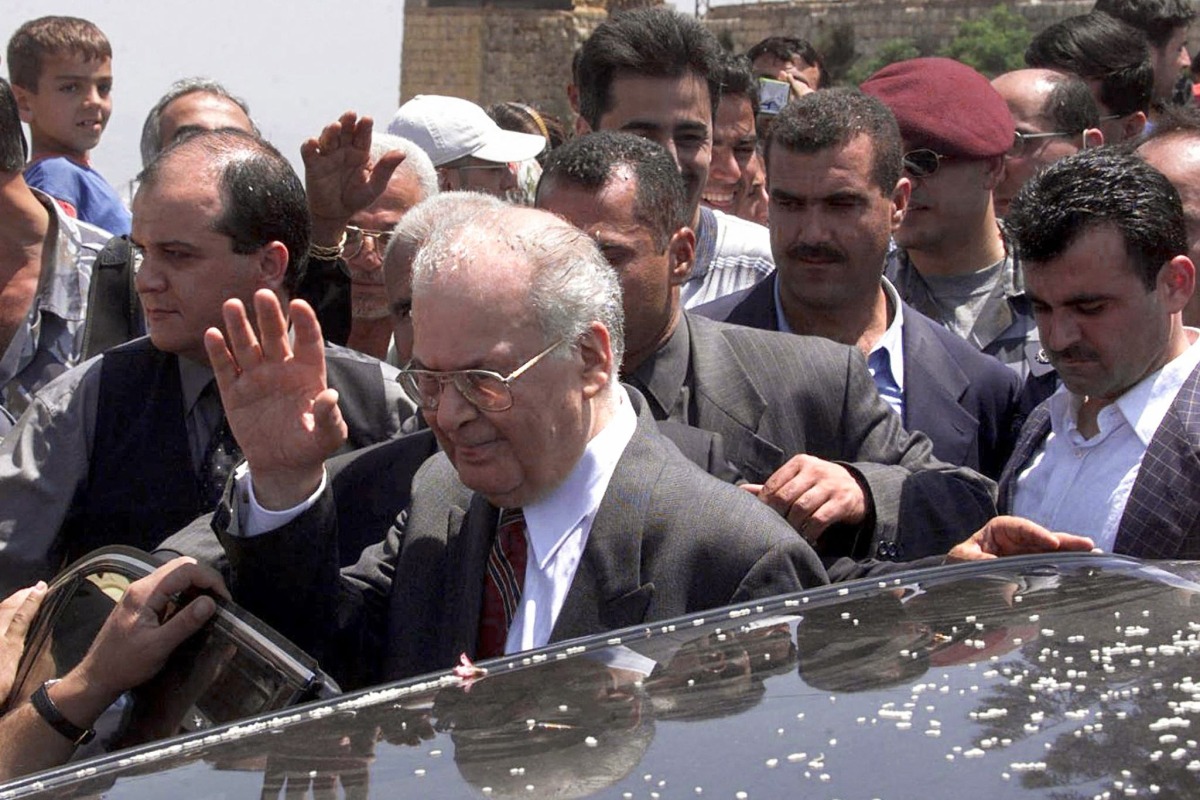 Lebanese Prime Minister Salim Hoss (centre) is showered with rice during a visit to  the southern Lebanese village of Khiam on May 25, 2000, after the withdrawal of Israeli forces from the western sector of the occupied zone in southern Lebanon. (AFP)